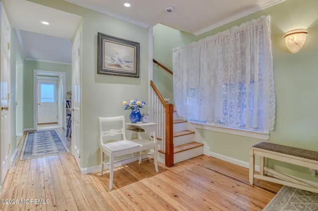 a kitchen with a refrigerator and a stove top oven