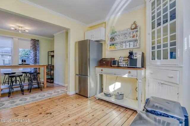 a dining room with a table and chairs in it