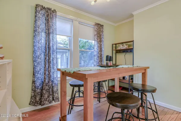 a view of a bedroom with a bed and a window