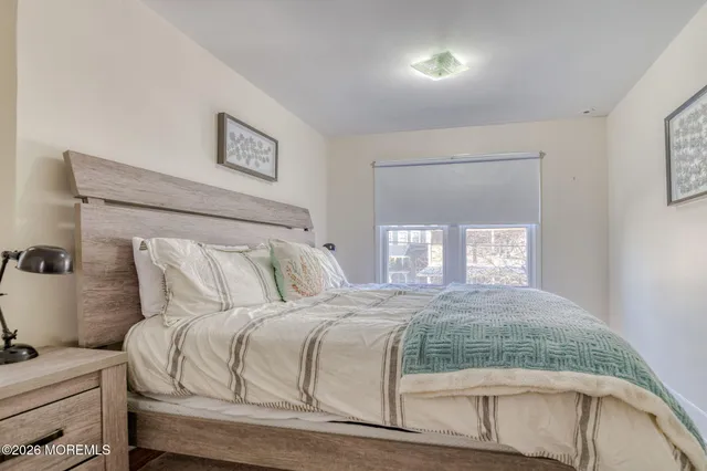 a bedroom with a bed and a chair