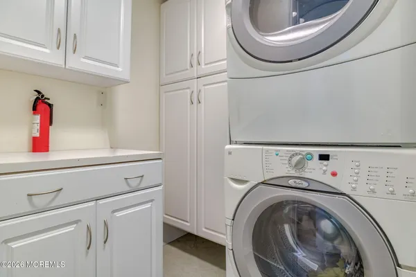 a bathroom with a sink mirror and toilet
