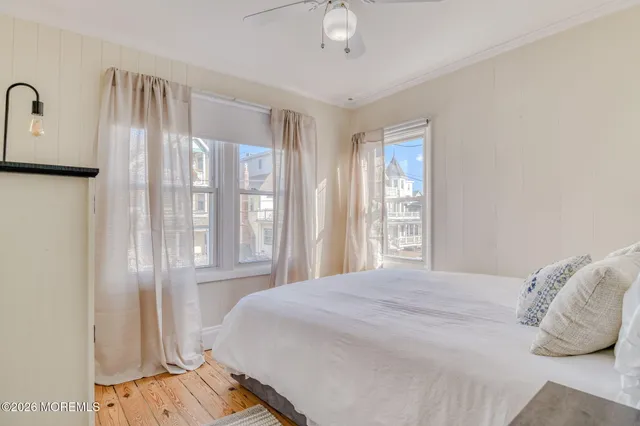 a bedroom with bed and a window