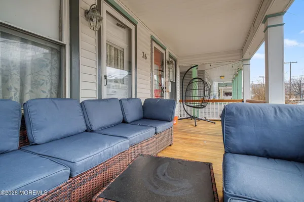 a view of a patio with table and chairs
