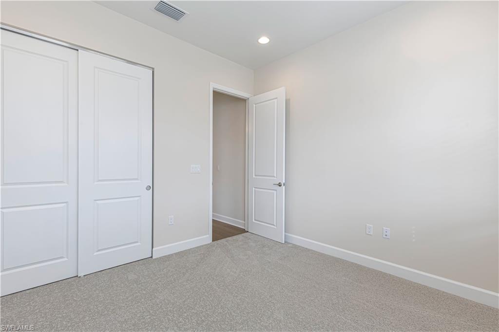 2691 Ridgecrest Place Naples, FL 34112 - Photo 6 of 27 a view of an empty room