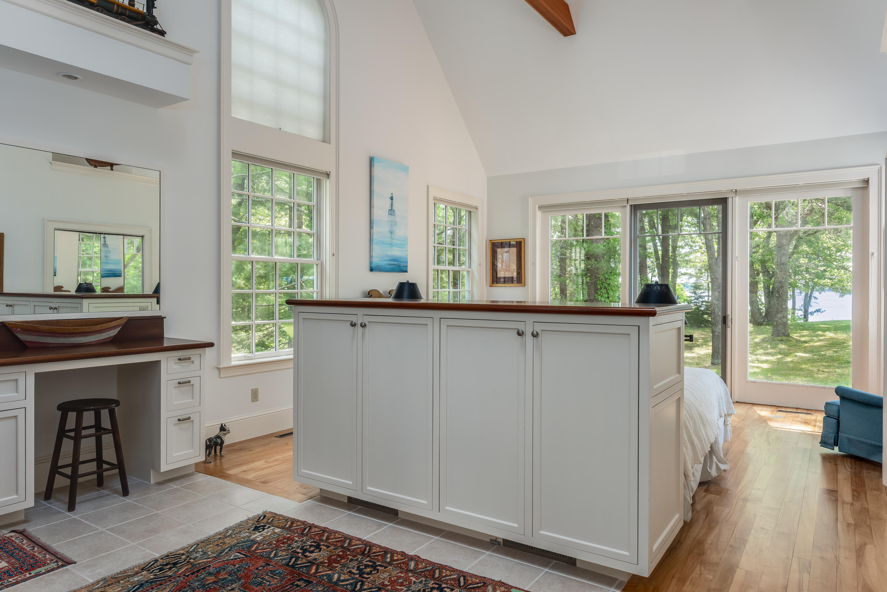1075 Old Post Road Cotuit, MA 02635 - Photo 16 of 40 a living room with a large window and a fireplace