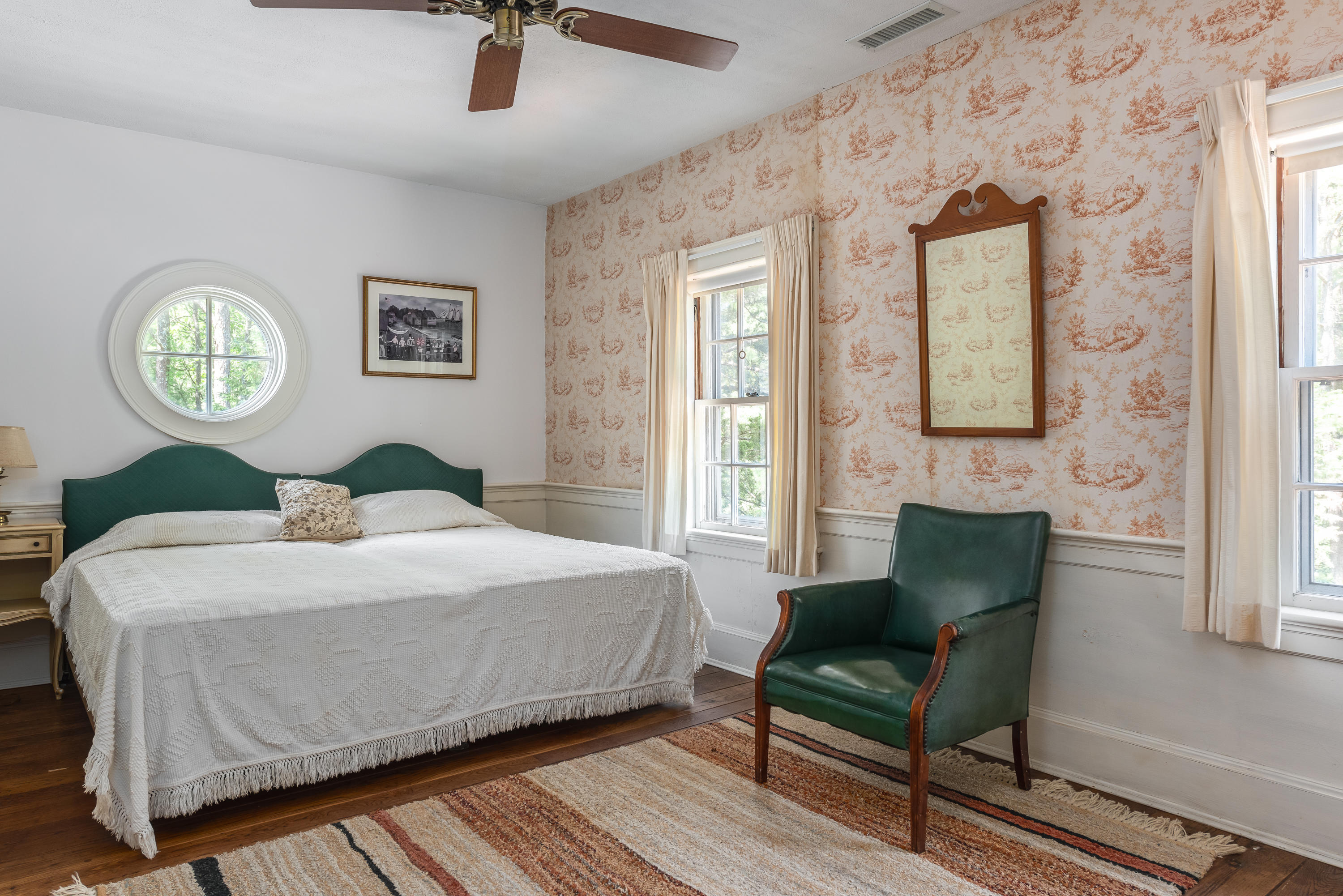 1075 Old Post Road Cotuit, MA 02635 - Photo 19 of 40 a bedroom with a bed and a table in it