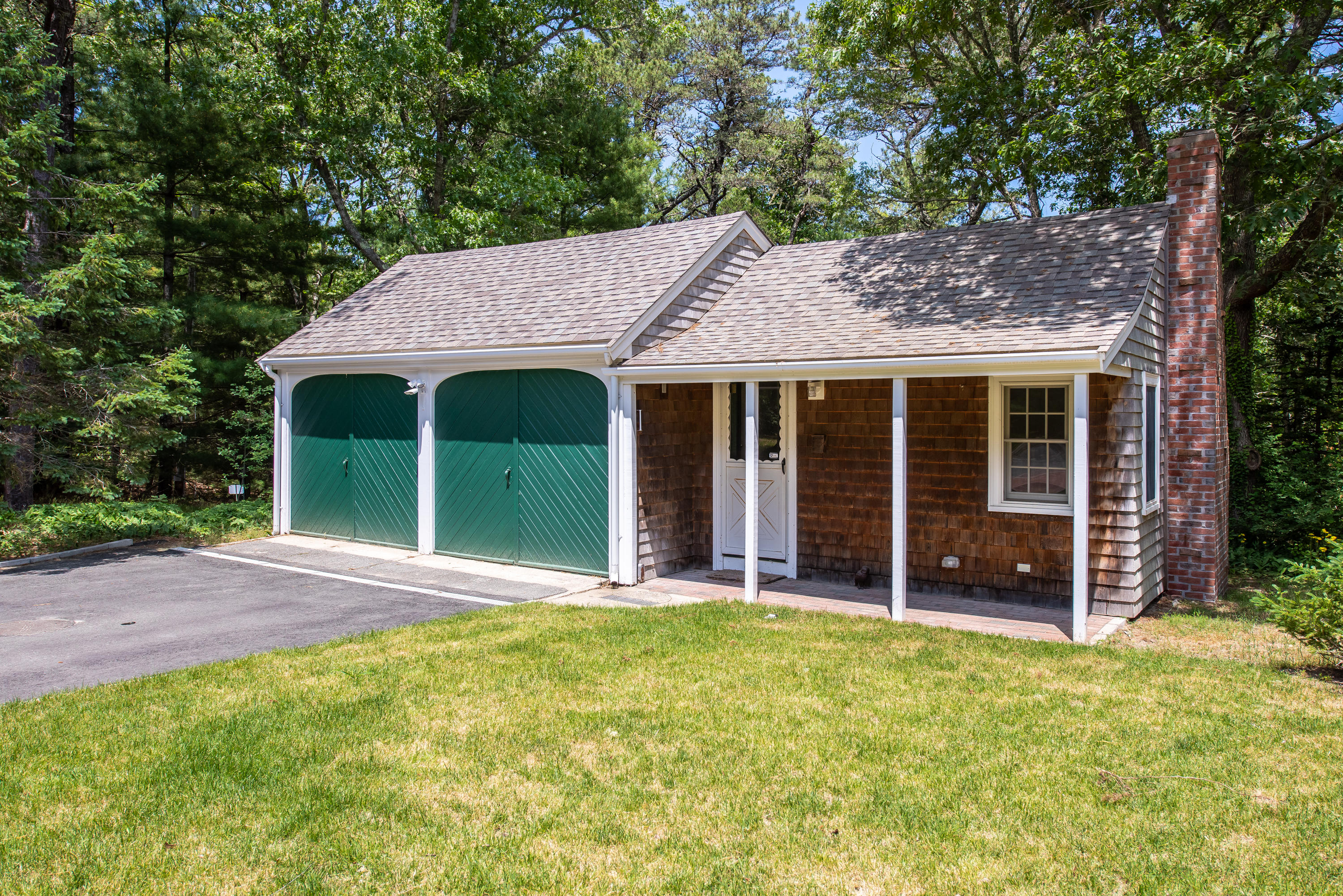 1075 Old Post Road Cotuit, MA 02635 - Photo 21 of 40 a view of a house with garden and yard