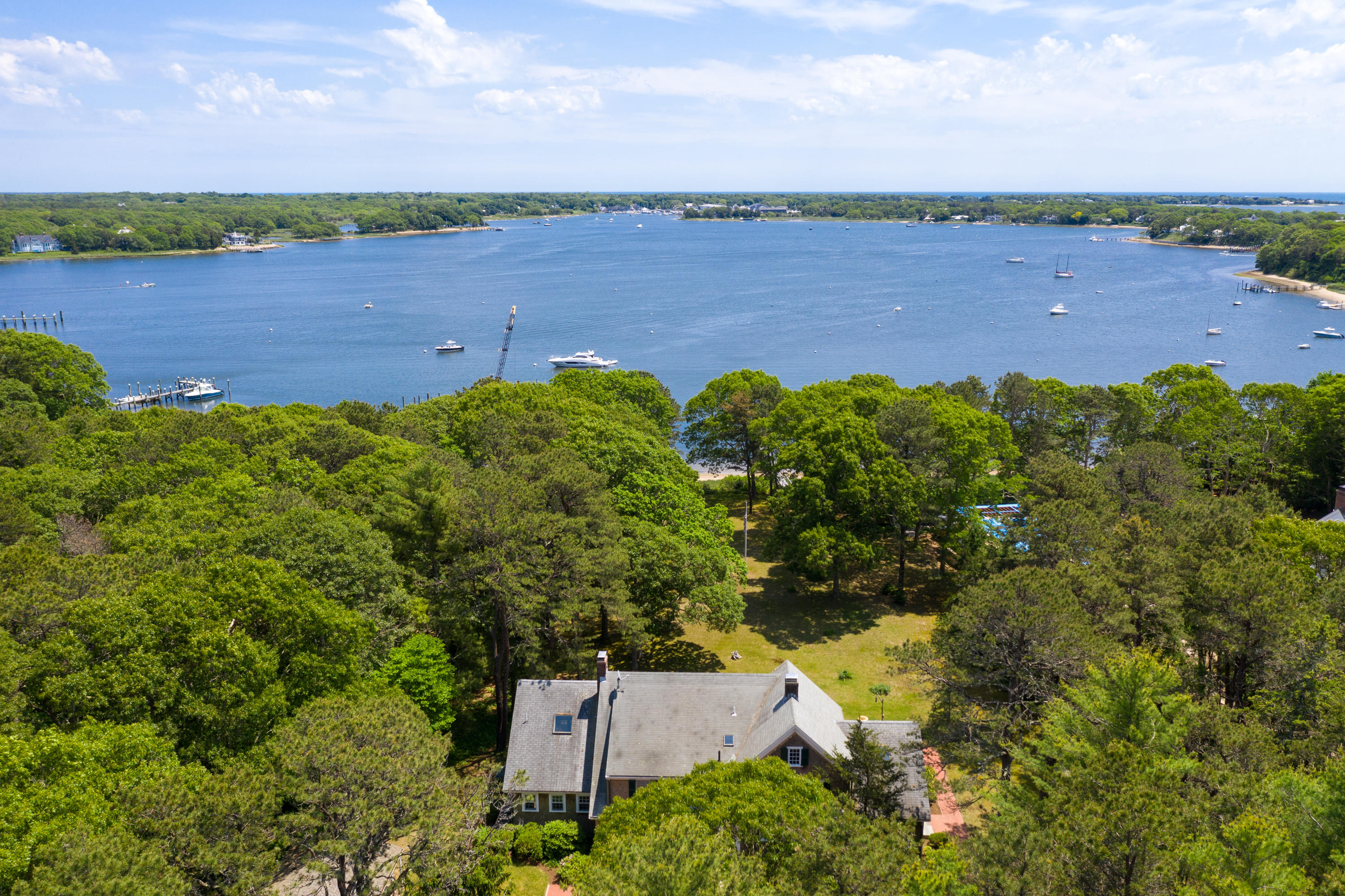 1075 Old Post Road Cotuit, MA 02635 - Photo 28 of 40 an aerial view of a house with a garden and lake view
