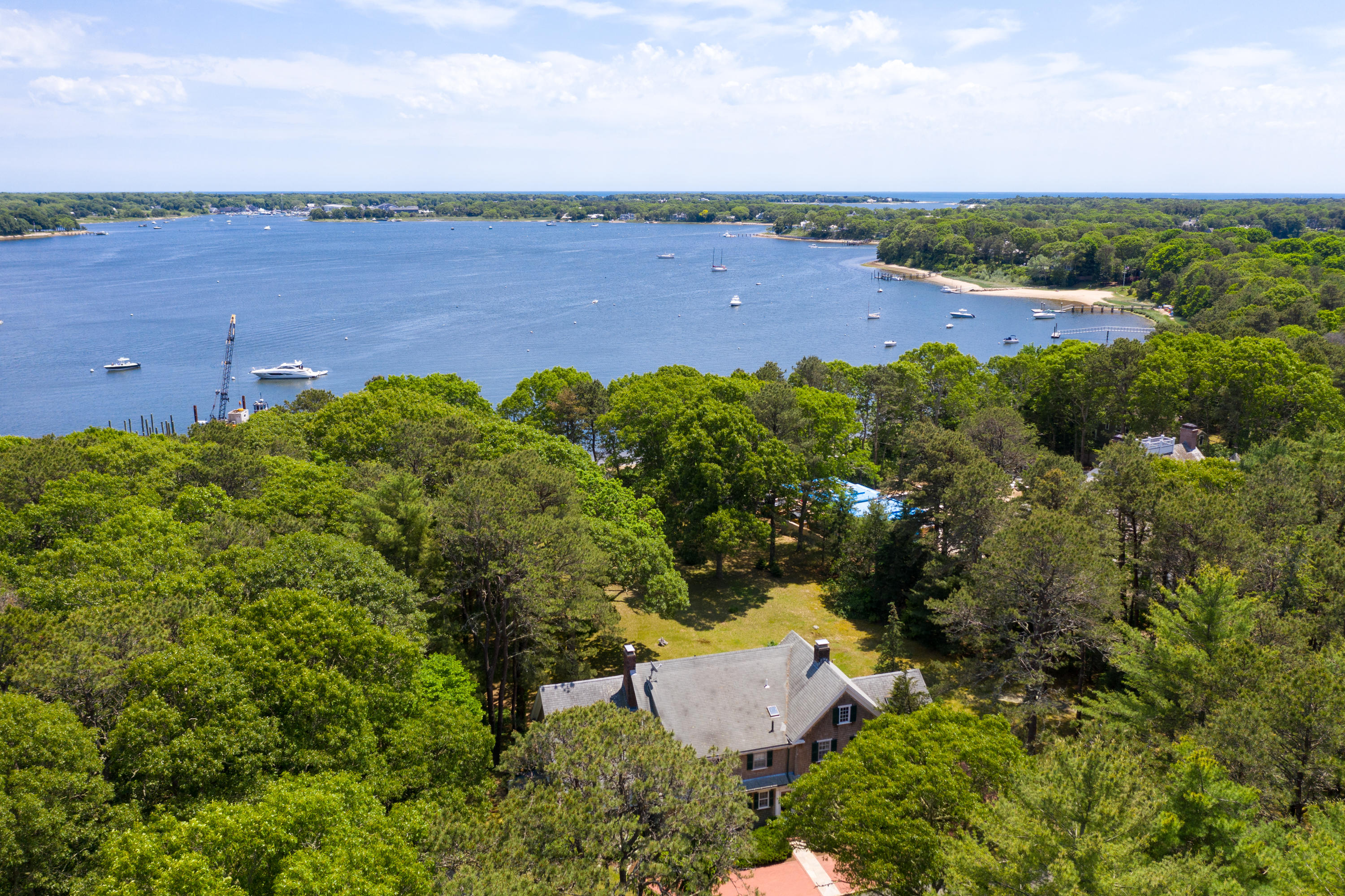 1075 Old Post Road Cotuit, MA 02635 - Photo 29 of 40 an aerial view of a house with garden space and outdoor seating