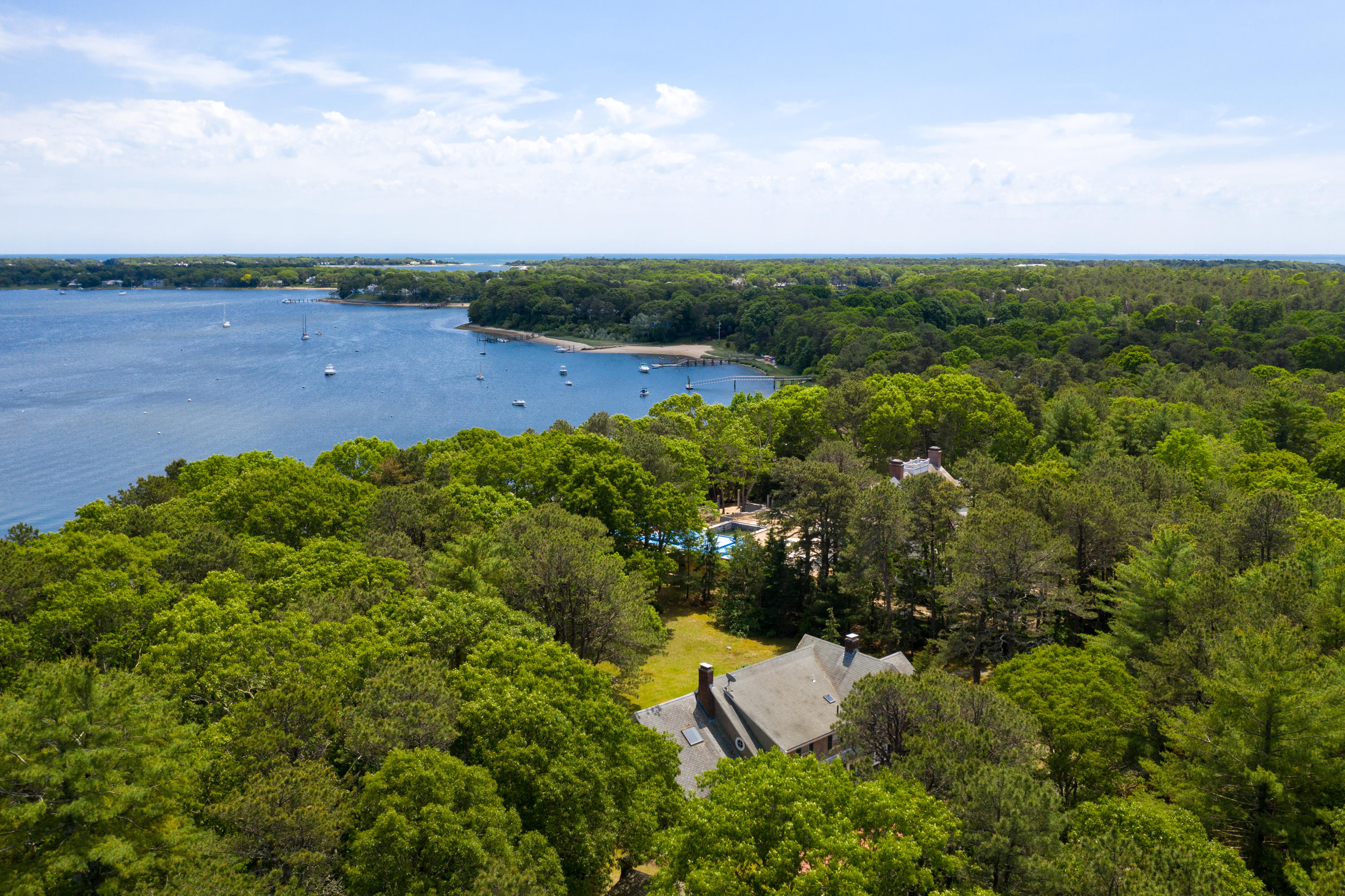 1075 Old Post Road Cotuit, MA 02635 - Photo 30 of 40 a view of a lake with houses in back