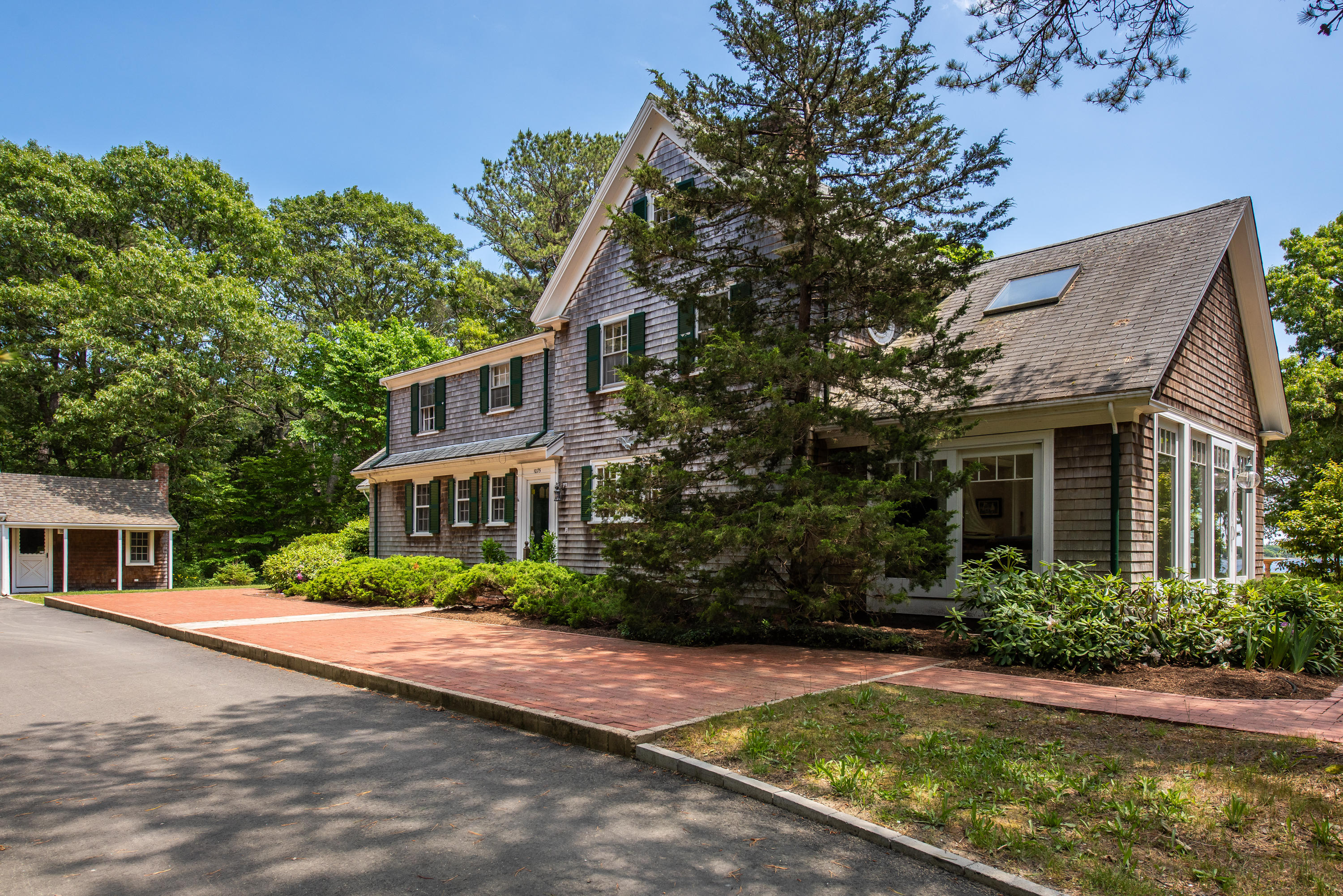 1075 Old Post Road Cotuit, MA 02635 - Photo 4 of 40 a front view of house with yard and green space