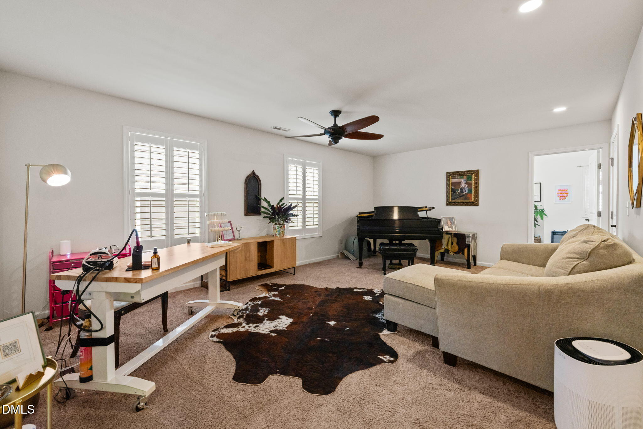 1716 Main Divide Drive Wake Forest, NC 27587 - Photo 28 of 45 a living room with furniture and a flat screen tv