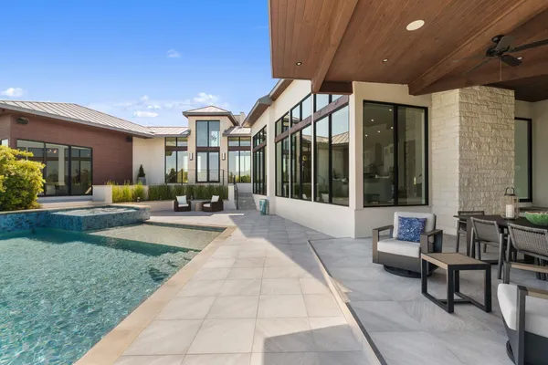 a swimming pool with outdoor seating and livingroom