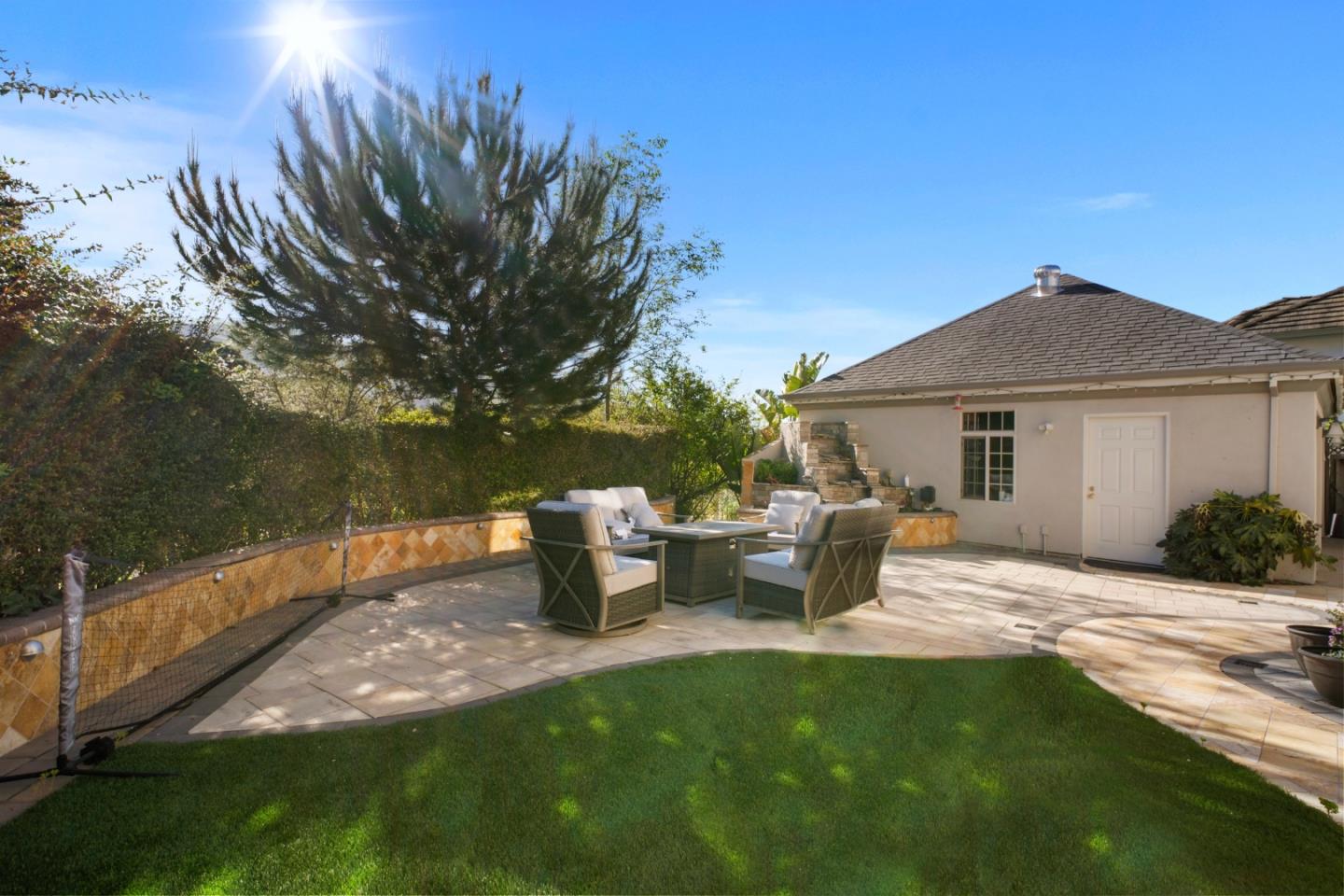 44450 Cavisson Court Fremont, CA 94539 - Photo 11 of 46 a view of a house with backyard sitting area and garden