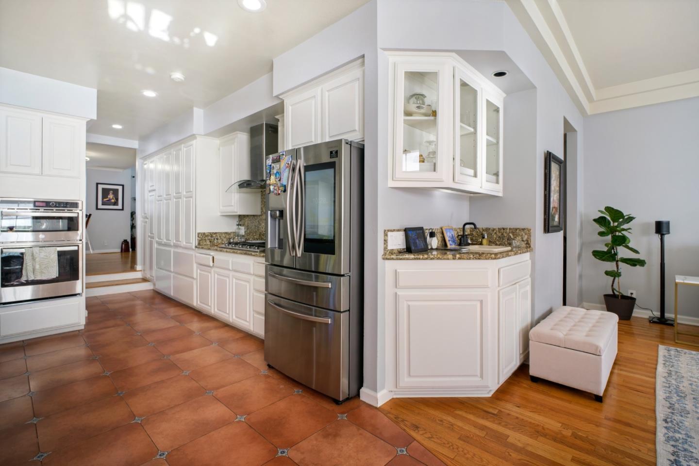 44450 Cavisson Court Fremont, CA 94539 - Photo 24 of 46 a kitchen with stainless steel appliances a refrigerator sink and cabinets