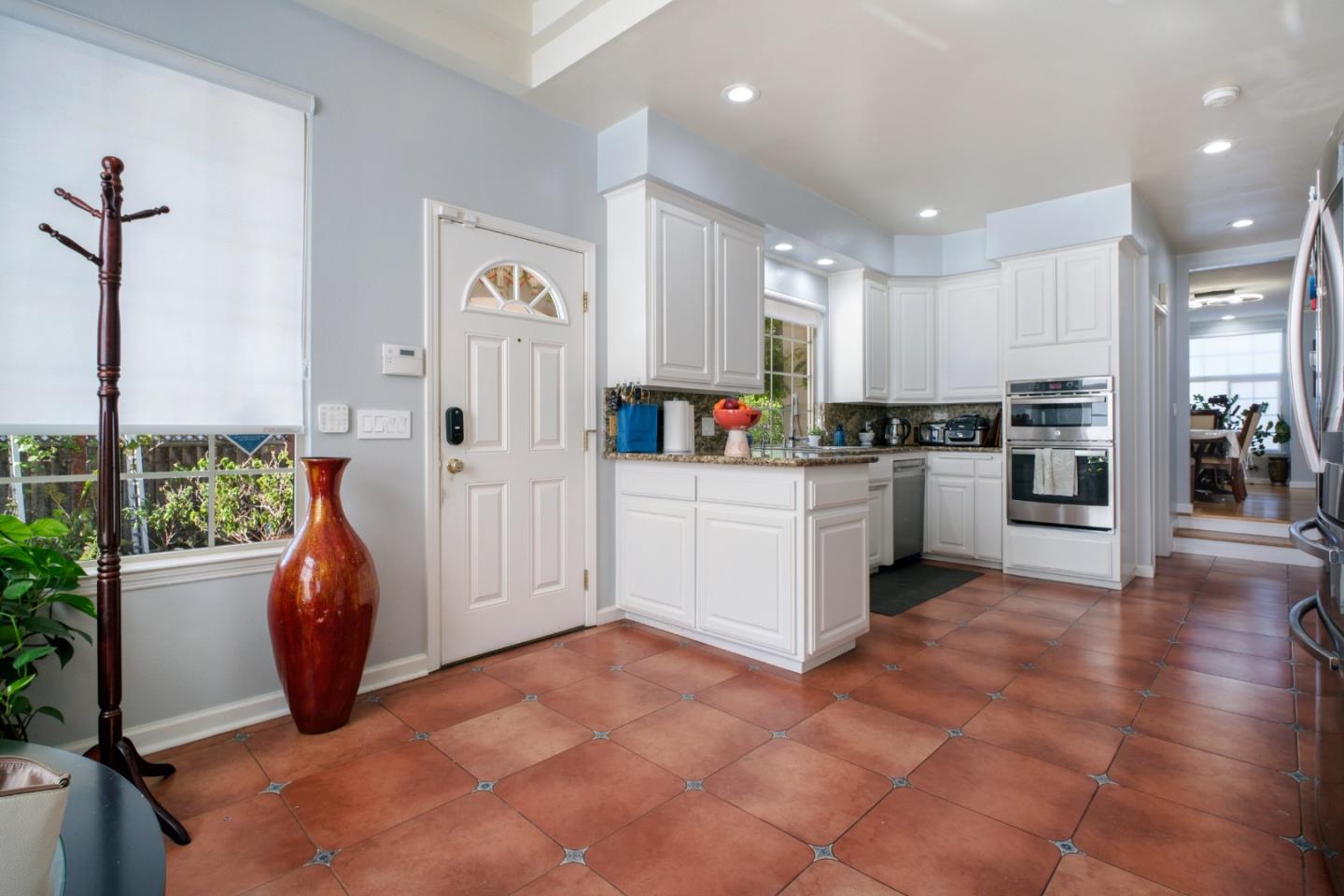 44450 Cavisson Court Fremont, CA 94539 - Photo 26 of 46 a kitchen with stainless steel appliances a refrigerator sink and cabinets