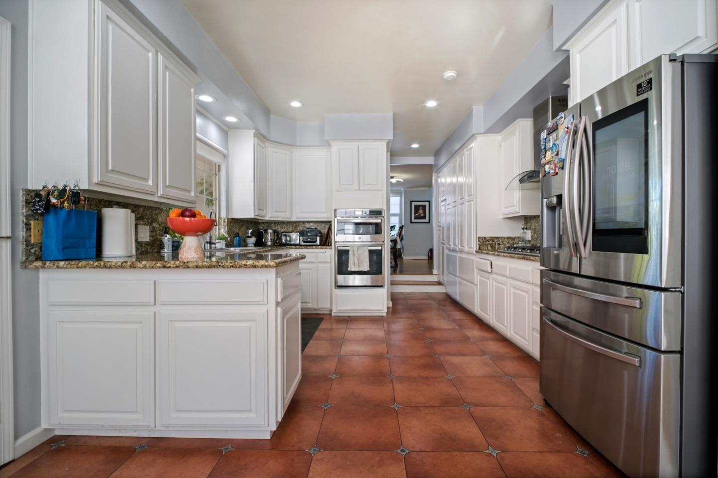 44450 Cavisson Court Fremont, CA 94539 - Photo 27 of 46 a kitchen with cabinets and stainless steel appliances