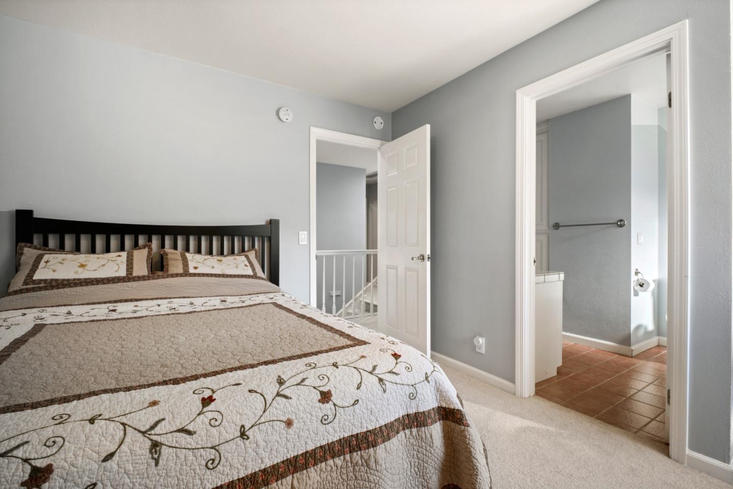 44450 Cavisson Court Fremont, CA 94539 - Photo 31 of 46 a bedroom with a bed and wooden floor
