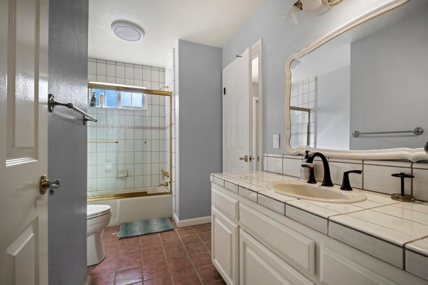 44450 Cavisson Court Fremont, CA 94539 - Photo 32 of 46 a bathroom with a double vanity sink toilet and shower