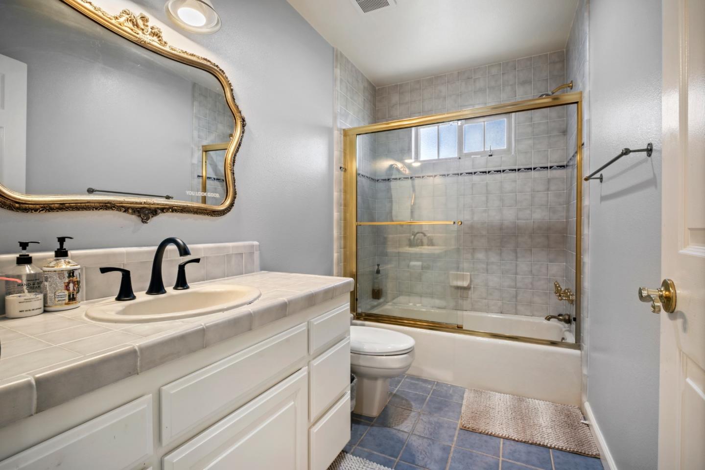 44450 Cavisson Court Fremont, CA 94539 - Photo 35 of 46 a bathroom with a sink a toilet and shower