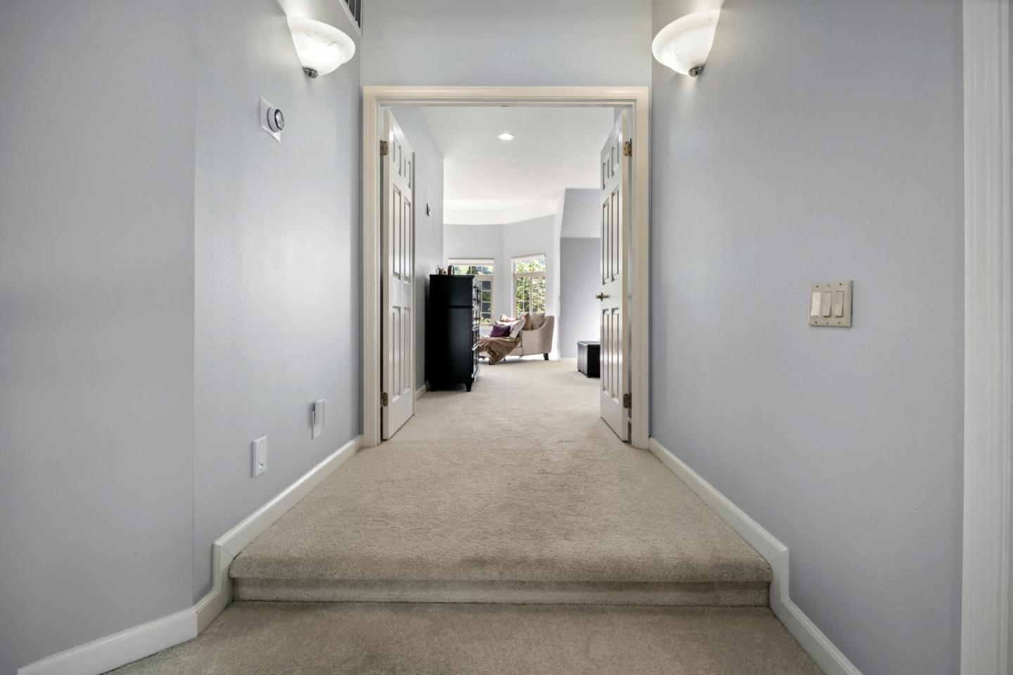 44450 Cavisson Court Fremont, CA 94539 - Photo 36 of 46 a view of a hallway with wooden floor and a bathroom