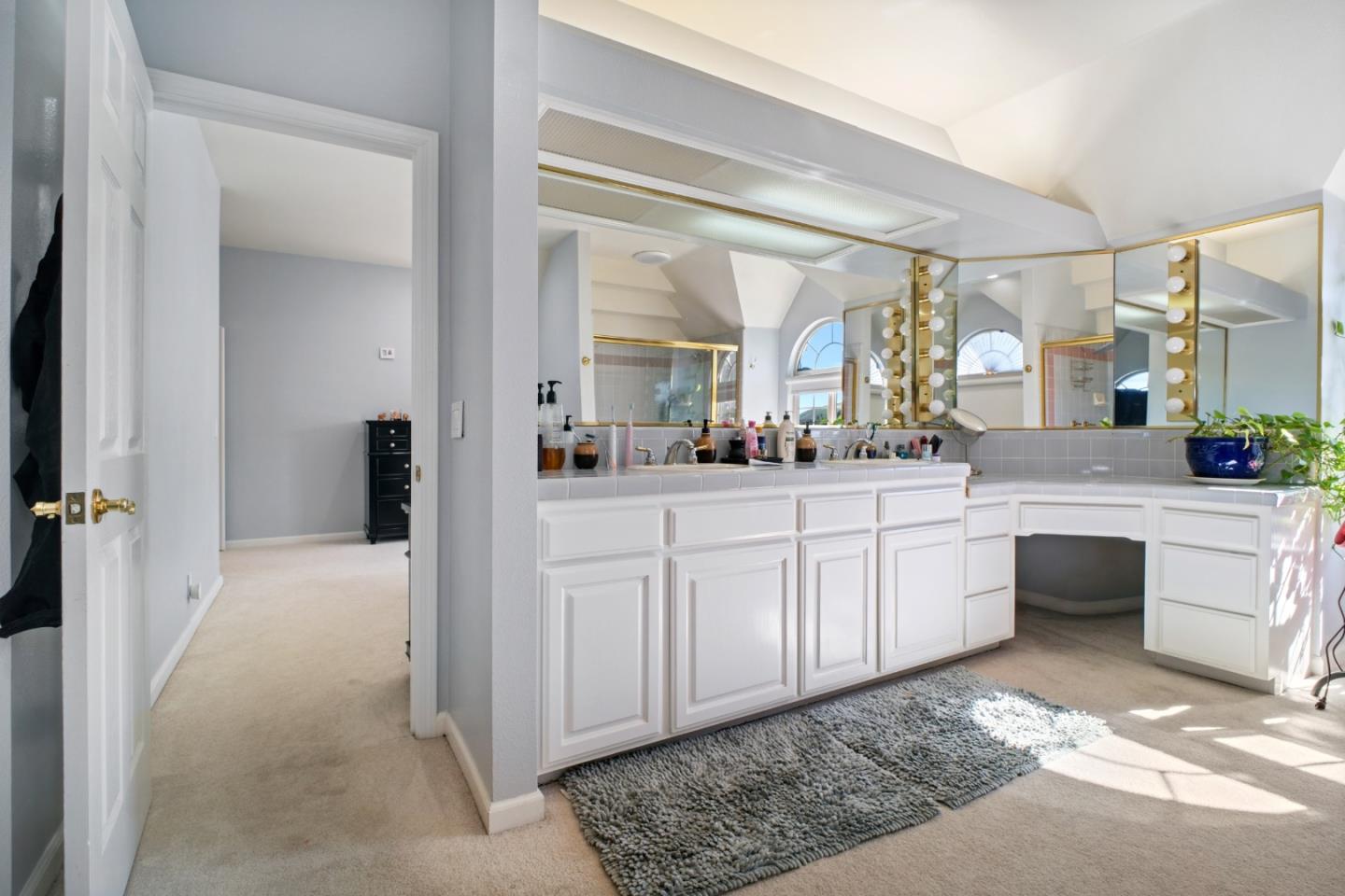 44450 Cavisson Court Fremont, CA 94539 - Photo 41 of 46 a large bathroom with a double vanity sink a mirror and a shower