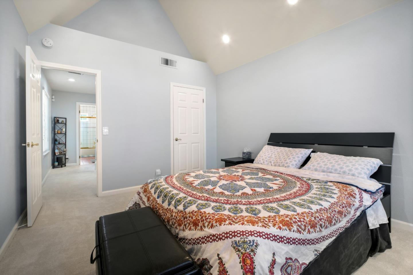 44450 Cavisson Court Fremont, CA 94539 - Photo 43 of 46 a bedroom with a bed and a mirror