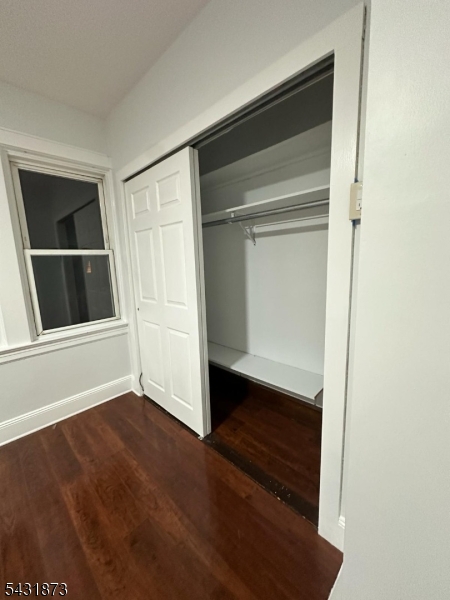 32 Hamilton Avenue, Unit 2 Fairview, NJ 07022 - Photo 19 of 30 a view of an empty room with wooden floor and a window