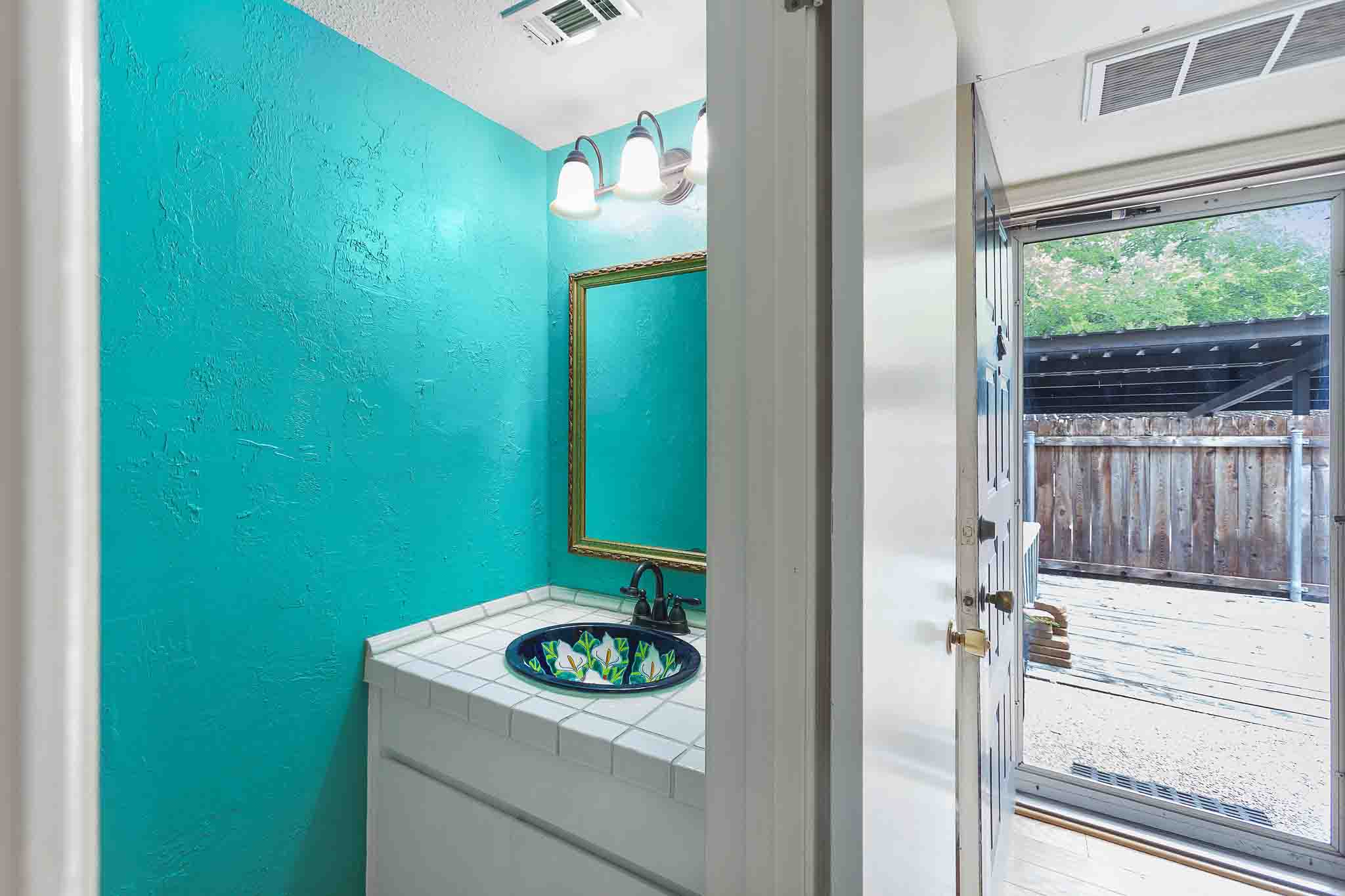 9226 Jollyville Road, Unit 132 Austin, TX 78759 - Photo 8 of 15 A vibrant powder room with a uniquely patterned sink.