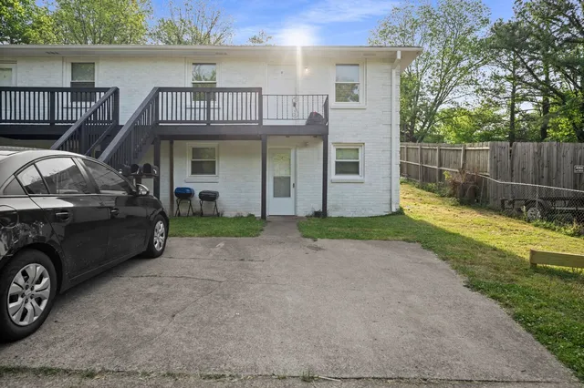 a view of a car parked in front of a house