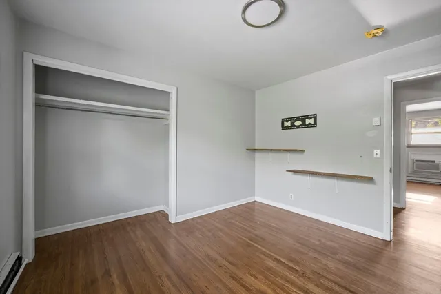 a view of a kitchen with wooden floor