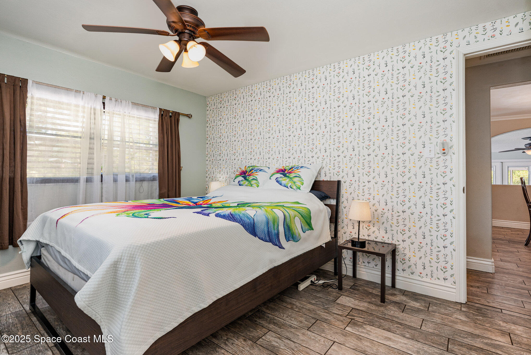 1304 Lichty Street Palm Bay, FL 32905 - Photo 14 of 63 a bedroom with a bed and wooden floor