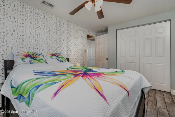 a bedroom with a bed and a table