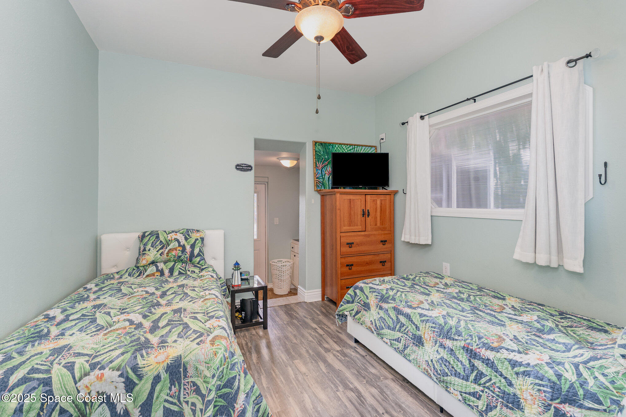 1304 Lichty Street Palm Bay, FL 32905 - Photo 23 of 63 a bedroom with a bed and a flat screen tv