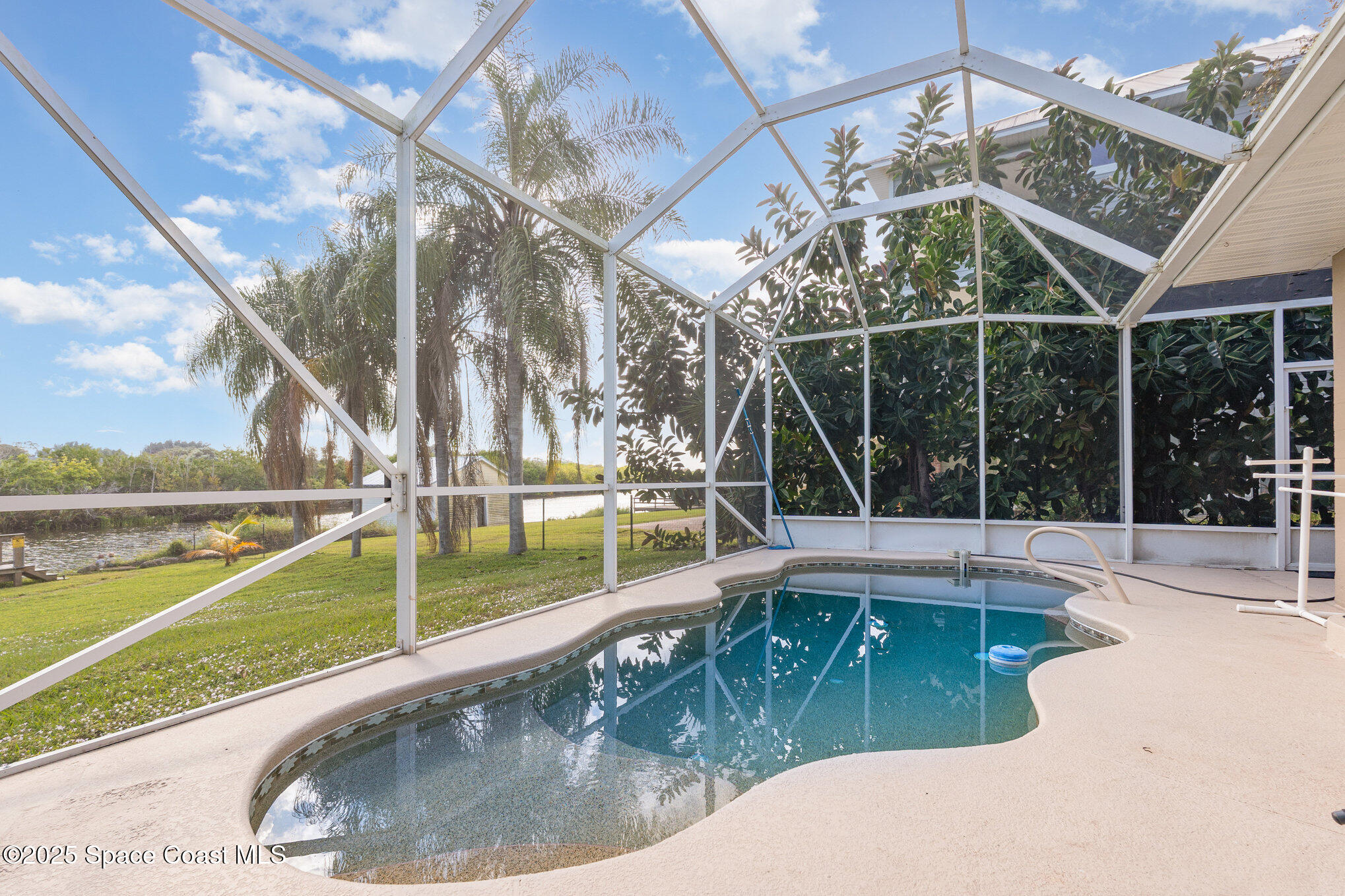 1304 Lichty Street Palm Bay, FL 32905 - Photo 32 of 63 a view of a swimming pool with a lake view