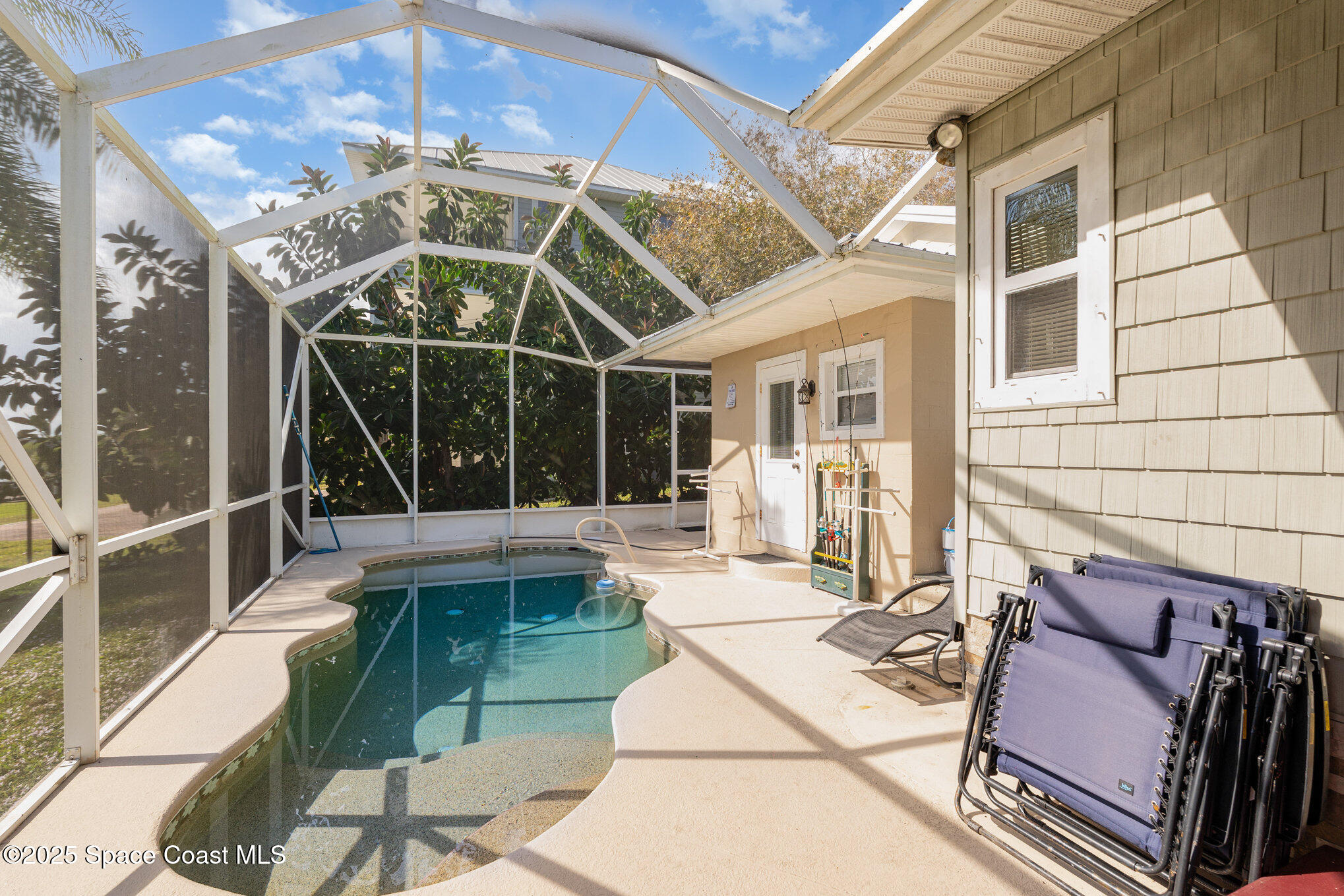 1304 Lichty Street Palm Bay, FL 32905 - Photo 33 of 63 a view of a patio with table and chairs with wooden floor and fence