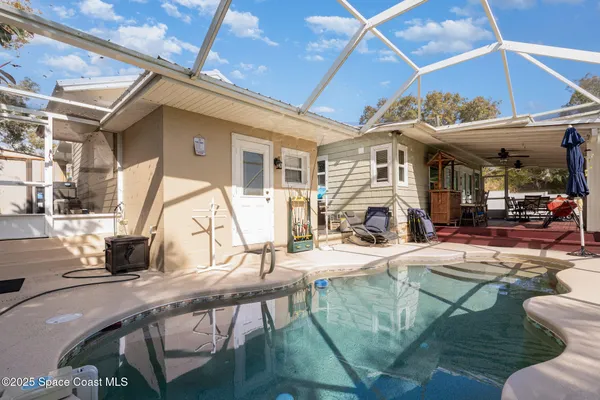 a view of a backyard of the house