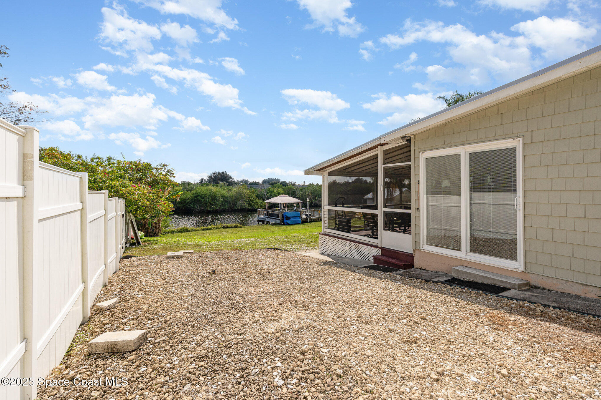1304 Lichty Street Palm Bay, FL 32905 - Photo 36 of 63 a view of a house with a backyard