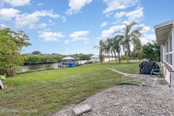 a view of balcony with couch and wooden floor