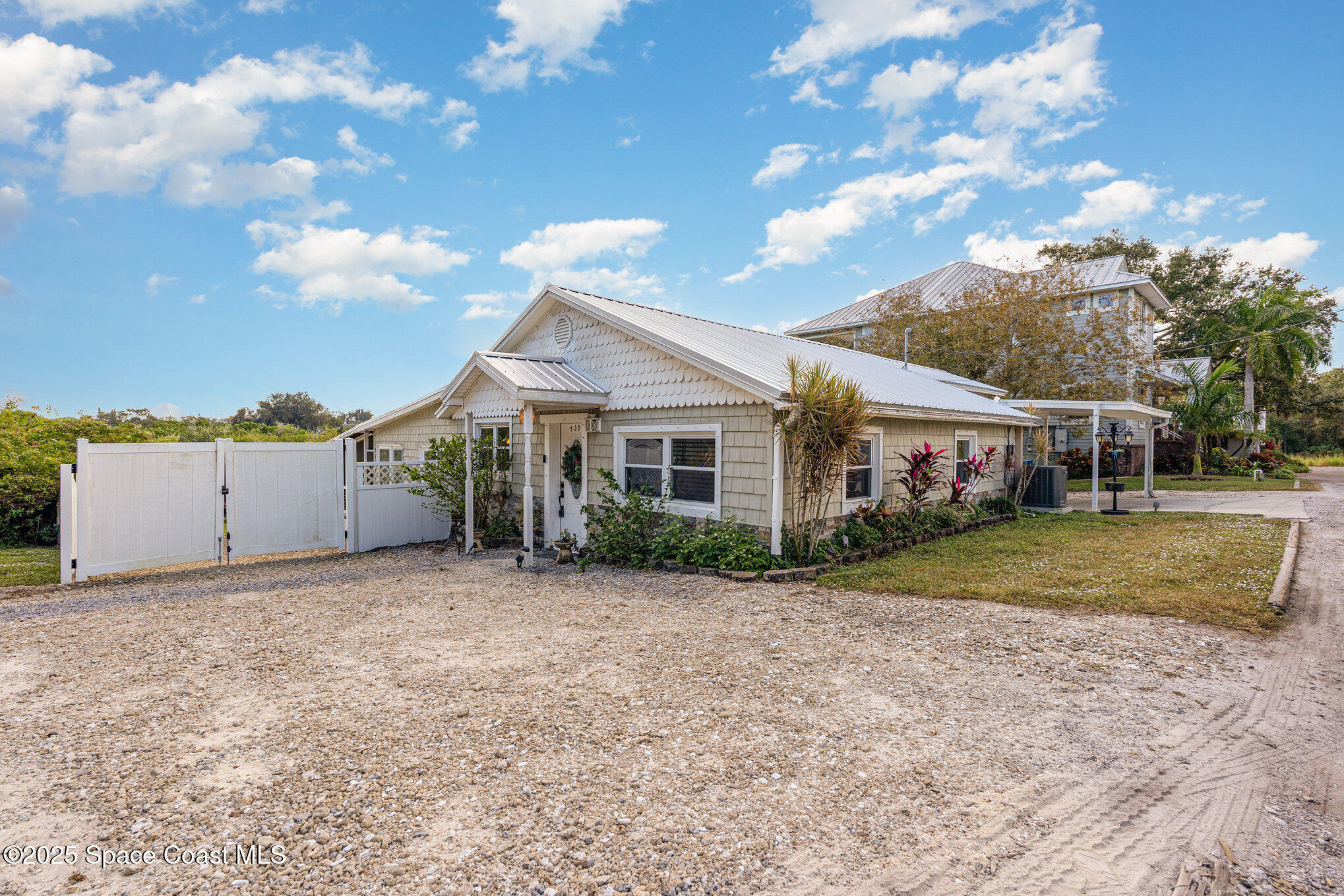 1304 Lichty Street Palm Bay, FL 32905 - Photo 4 of 63 a view of a house with a yard and pathway