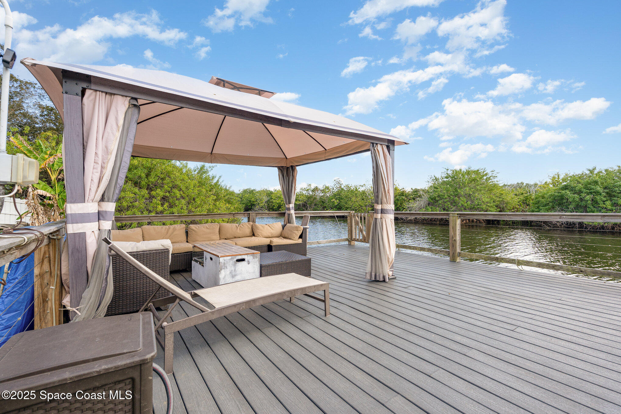 1304 Lichty Street Palm Bay, FL 32905 - Photo 42 of 63 a view of balcony with couch and wooden floor