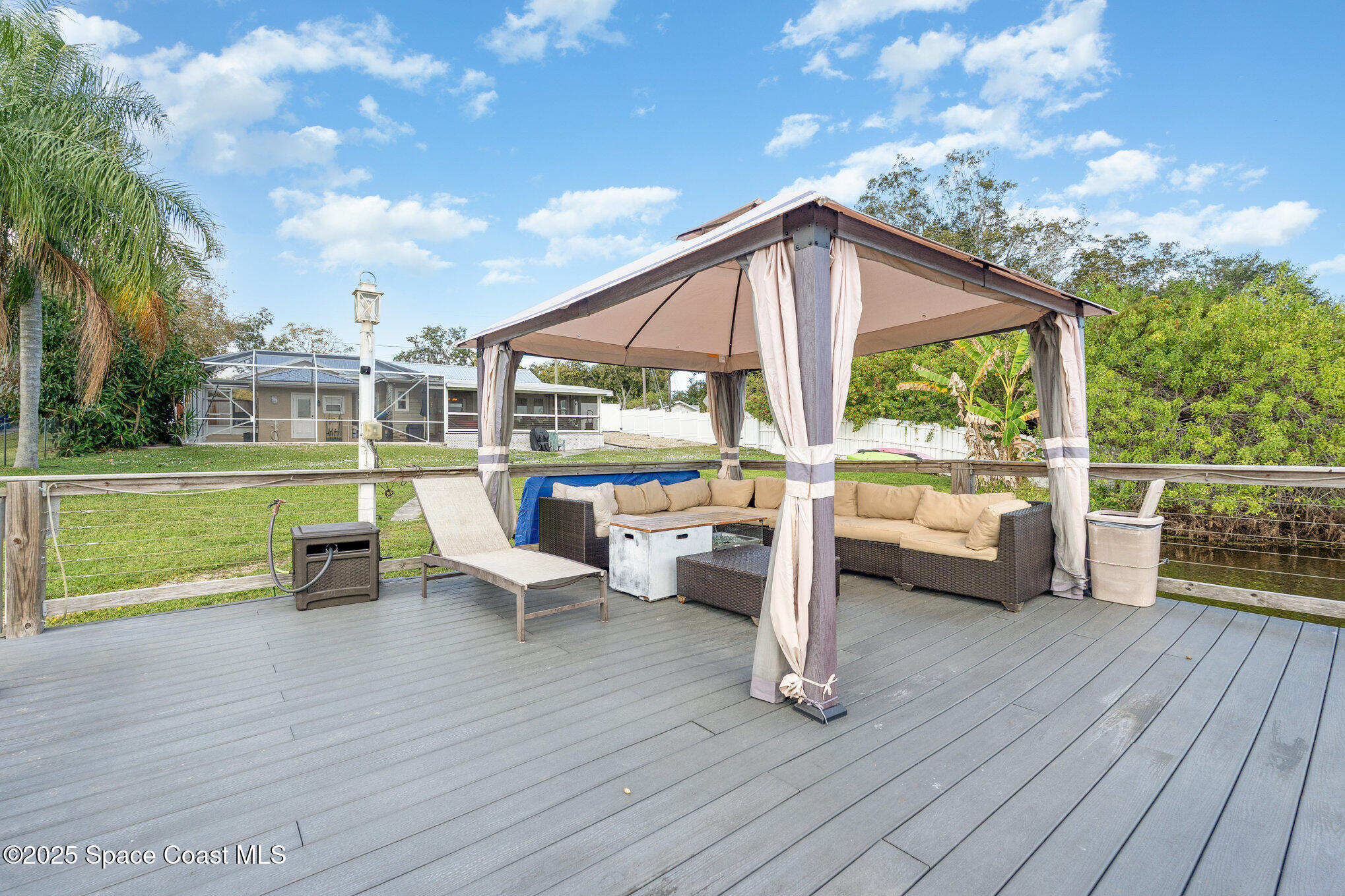 1304 Lichty Street Palm Bay, FL 32905 - Photo 44 of 63 a view of a terrace with wooden floor and bench