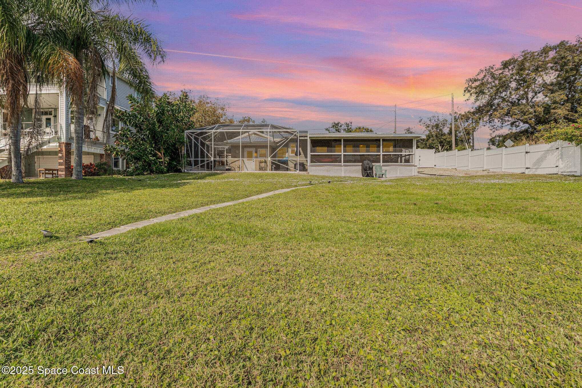 1304 Lichty Street Palm Bay, FL 32905 - Photo 47 of 63 a front view of a house with a yard