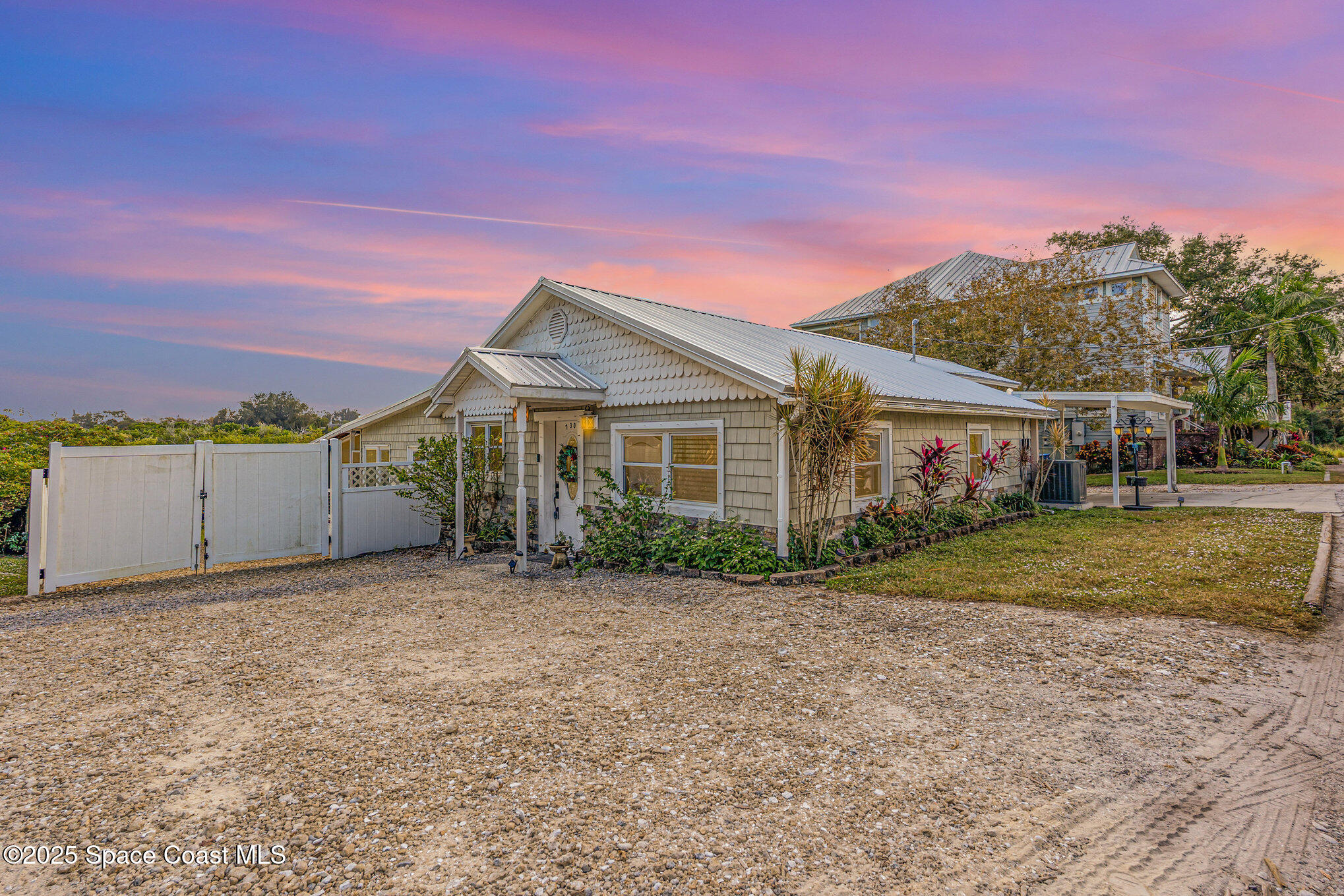 1304 Lichty Street Palm Bay, FL 32905 - Photo 48 of 63 a view of a house with a yard