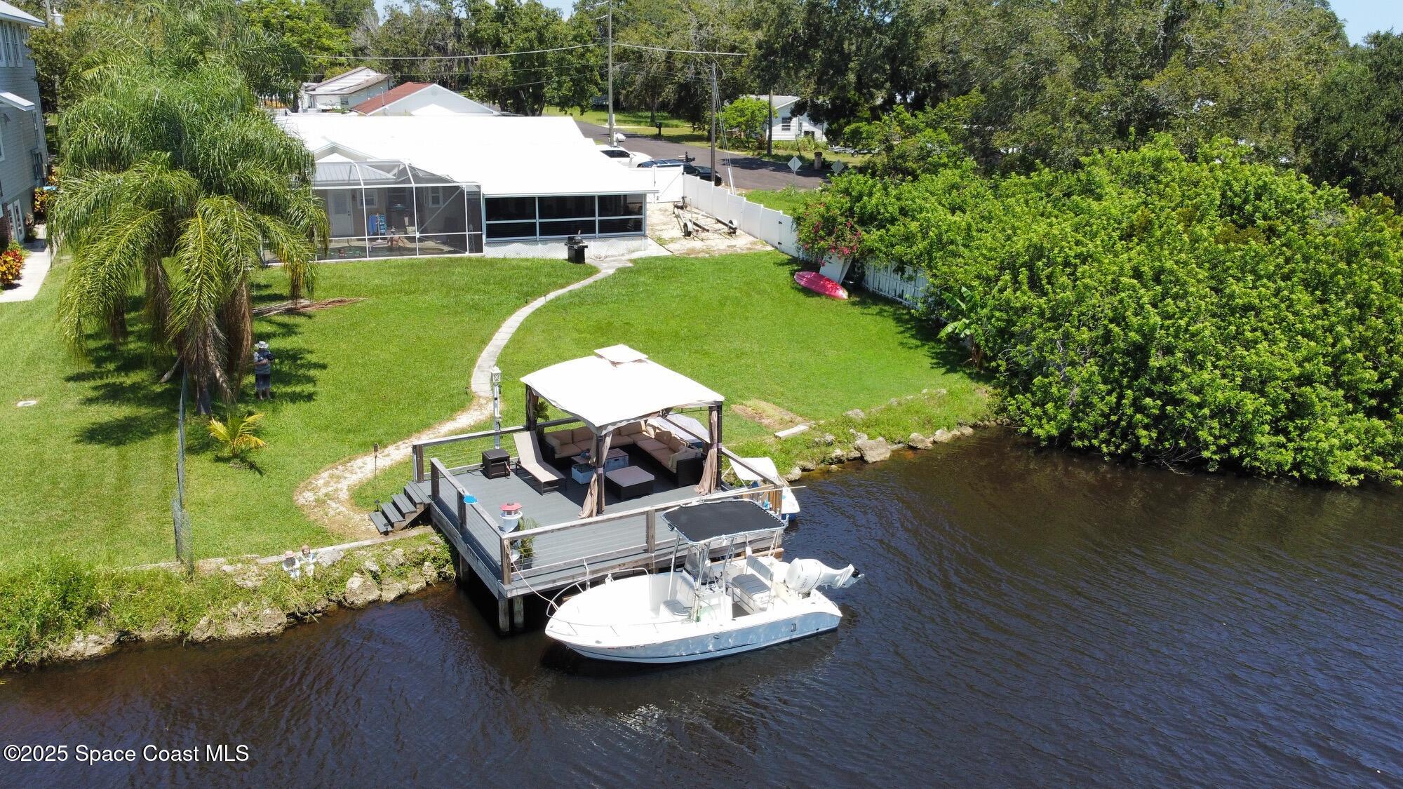 1304 Lichty Street Palm Bay, FL 32905 - Photo 49 of 63 a view of a swimming pool with a patio