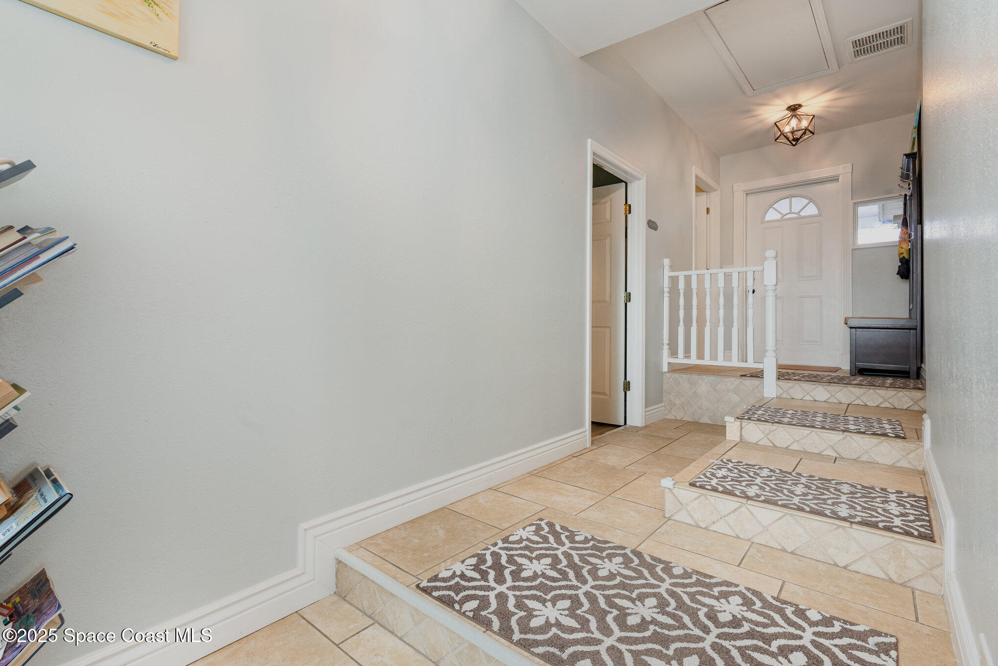 1304 Lichty Street Palm Bay, FL 32905 - Photo 7 of 63 a view of a big room with wooden floor and a rug
