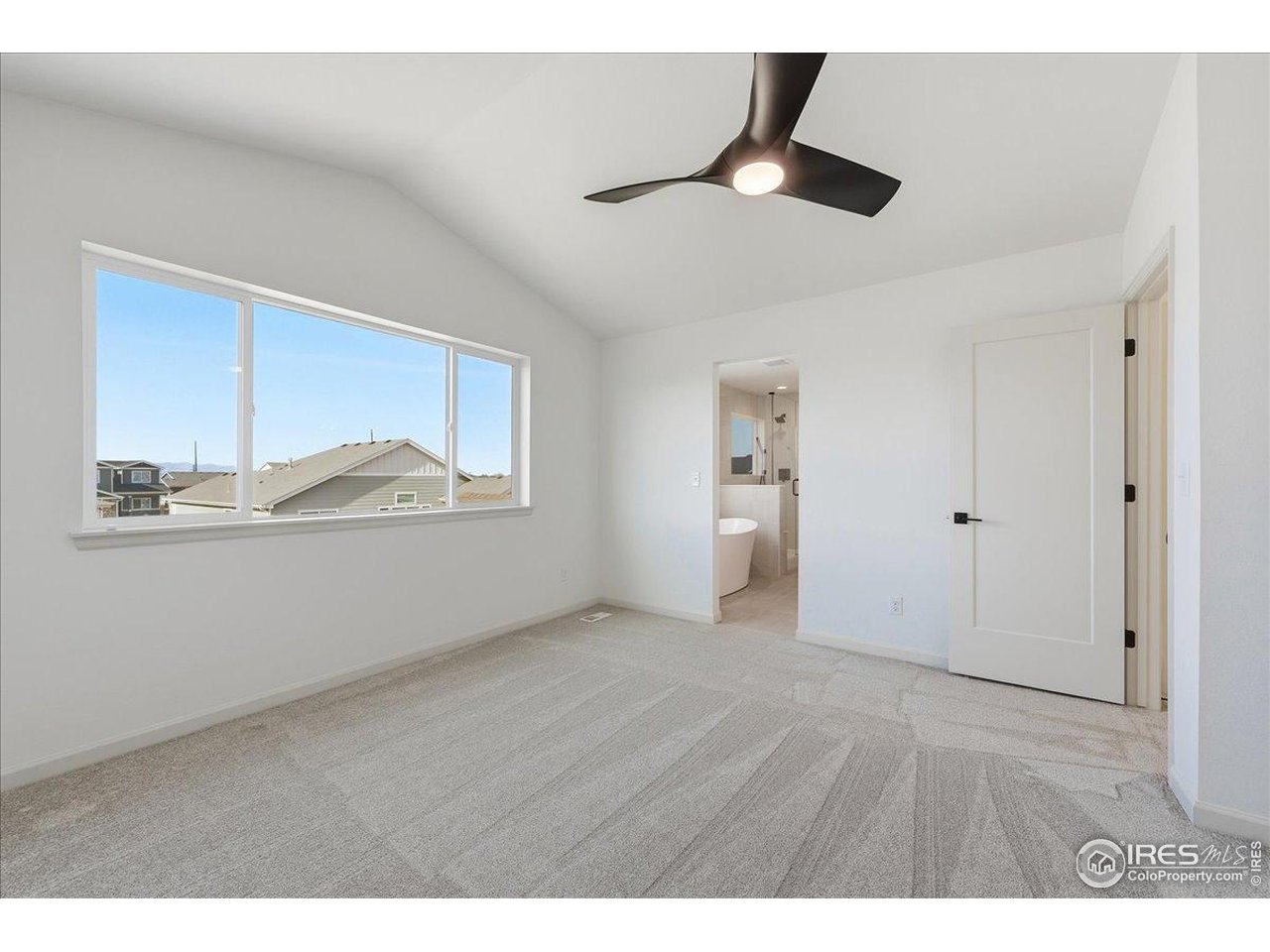 825 Doubleleaf Drive Windsor, CO 80550 - Photo 15 of 25 a view of empty room with wooden floor