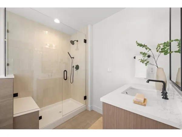 a bathroom with a sink and a shower
