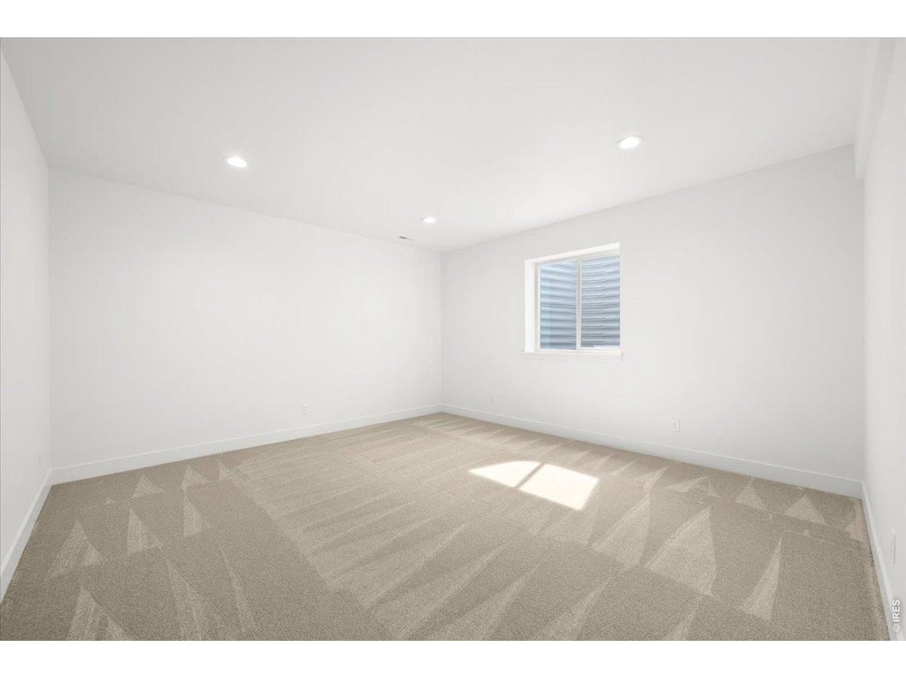 825 Doubleleaf Drive Windsor, CO 80550 - Photo 22 of 28 a view of an empty room with a window