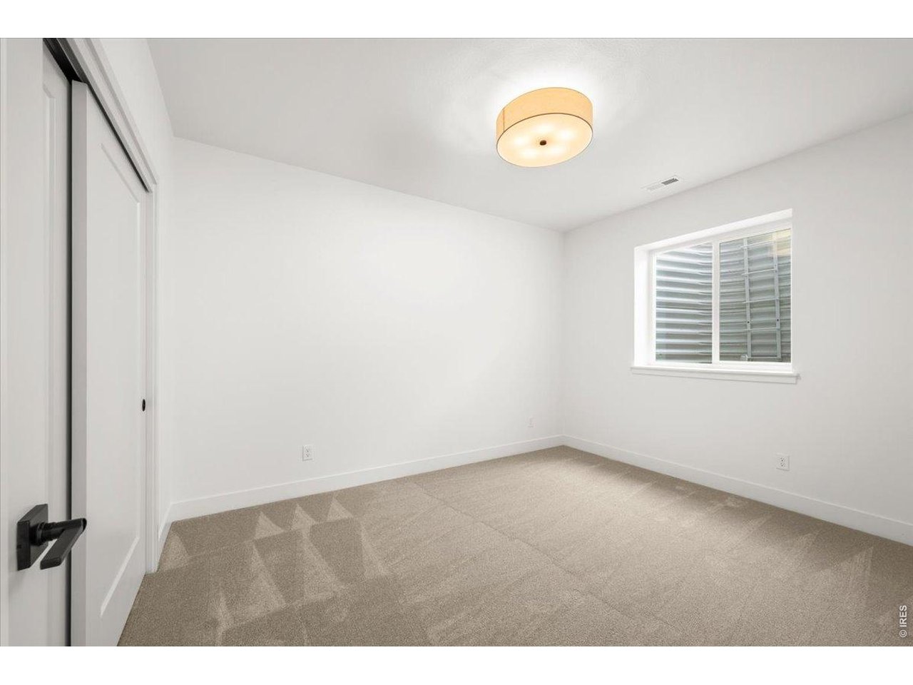 825 Doubleleaf Drive Windsor, CO 80550 - Photo 23 of 28 a view of an empty room with a window